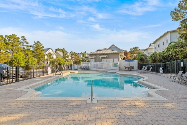 view of swimming pool with a patio area