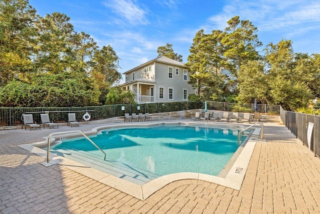 view of swimming pool with a patio area