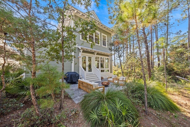 rear view of property with a patio area