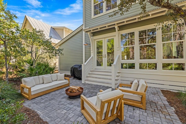 view of patio / terrace with a grill and a fire pit