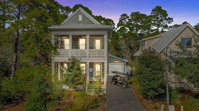 view of front of home with an outbuilding and a garage