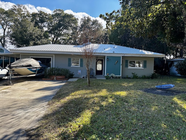 single story home featuring a front yard and a garage