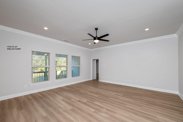 spare room with crown molding, ceiling fan, and light hardwood / wood-style floors