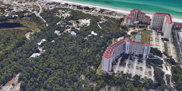 bird's eye view featuring a water view and a beach view