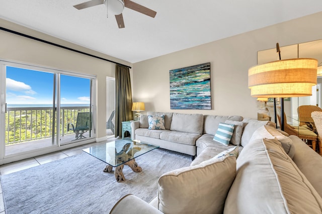 tiled living room with ceiling fan