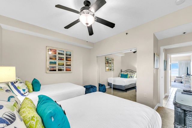 bedroom featuring carpet flooring, a closet, and ceiling fan