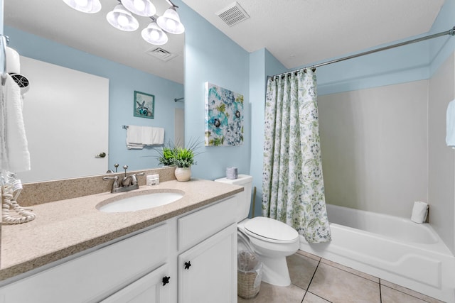 full bathroom with shower / tub combo, a textured ceiling, toilet, vanity, and tile patterned floors