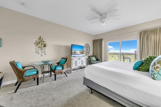 carpeted bedroom featuring ceiling fan and access to outside