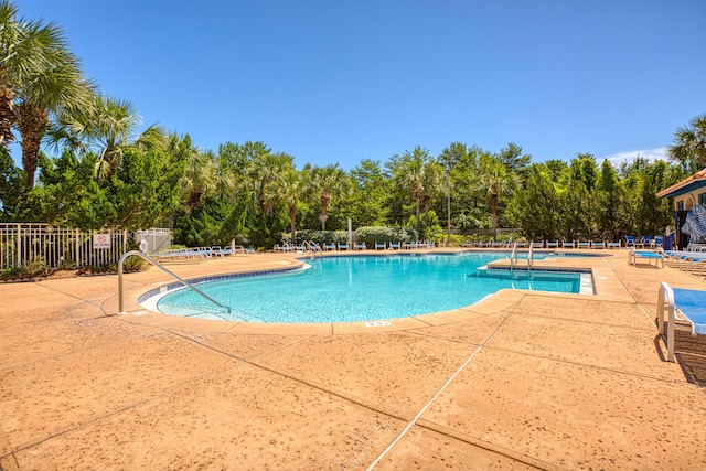 view of swimming pool with a patio area