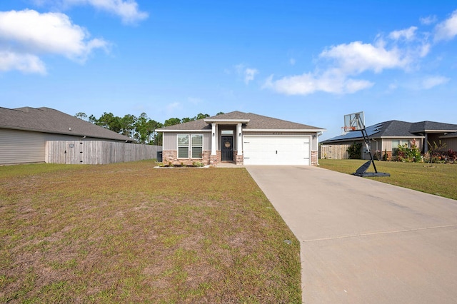 view of front of property featuring a front yard and a garage