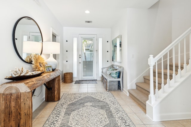 entrance foyer featuring stairway, light tile patterned floors, recessed lighting, and visible vents