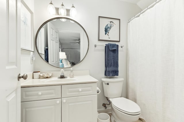 bathroom with vanity, a ceiling fan, and toilet