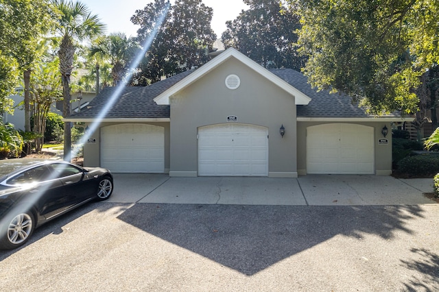 garage featuring driveway
