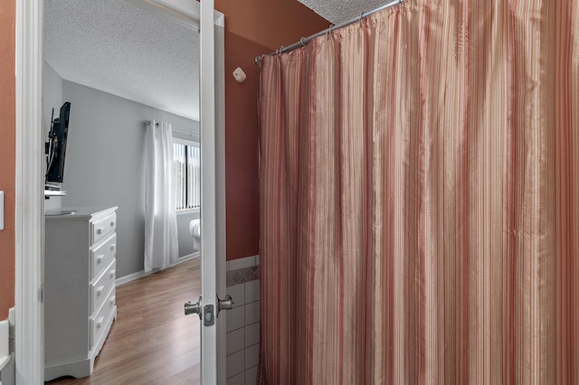 285 Payne St Unit 20B, Miramar Beach, FL 32550 - full bath featuring a textured ceiling and wood finished floors