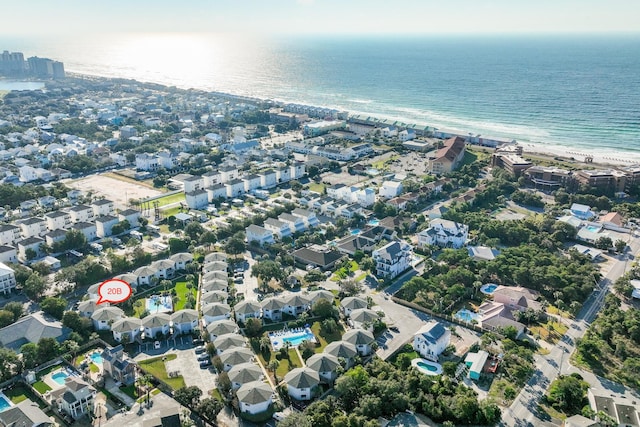 drone / aerial view featuring a view of the beach and a water view