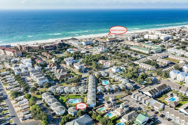 bird's eye view featuring a view of the beach and a water view