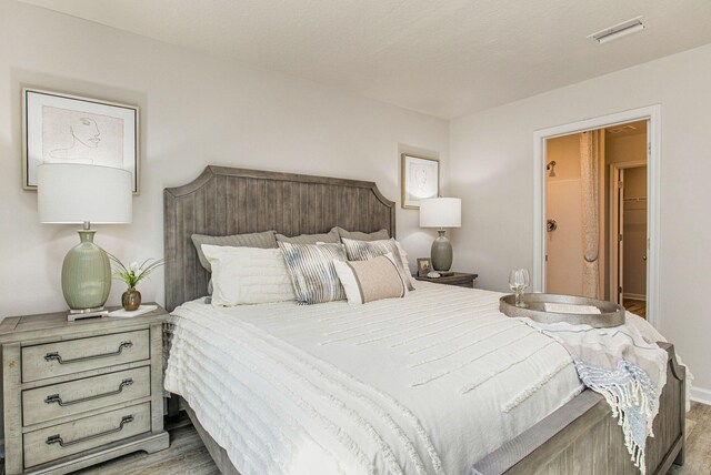 bedroom featuring light wood-type flooring