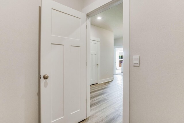 hallway featuring light wood-type flooring