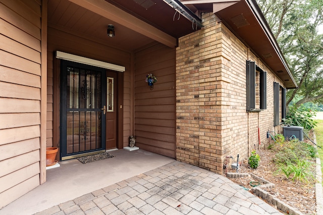 property entrance with central AC unit