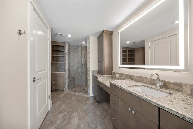 full bathroom with recessed lighting, a shower stall, visible vents, and vanity