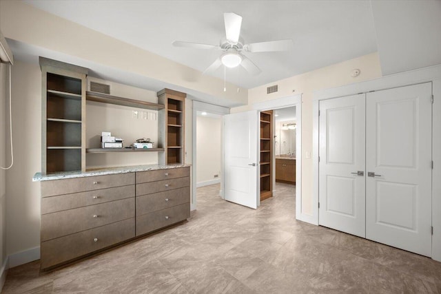 unfurnished bedroom with baseboards, visible vents, and a closet