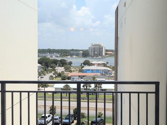 balcony featuring a water view