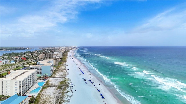 bird's eye view with a water view and a beach view