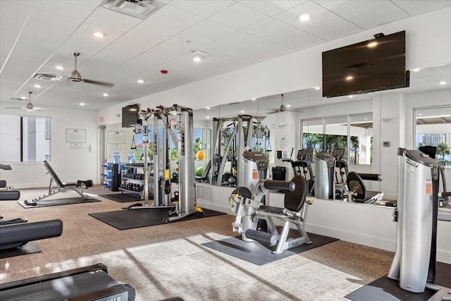 workout area featuring baseboards, visible vents, a ceiling fan, and recessed lighting