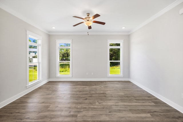 spare room featuring ornamental molding, dark hardwood / wood-style floors, and ceiling fan