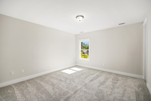 empty room featuring light colored carpet