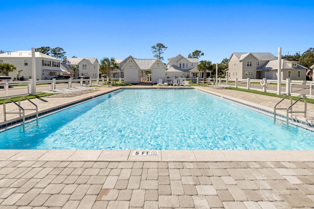 view of swimming pool with a patio