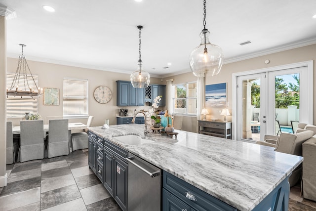 kitchen with a wealth of natural light, blue cabinets, dishwasher, and a kitchen island with sink