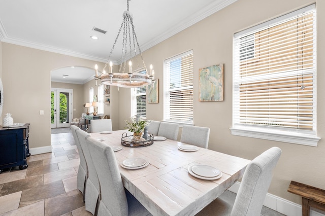 18 Spyglass Dr, Miramar Beach, FL 32550 - dining area featuring arched walkways, a chandelier, crown molding, recessed lighting, and light stone finish flooring