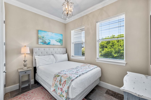 bedroom featuring ornamental molding and a chandelier