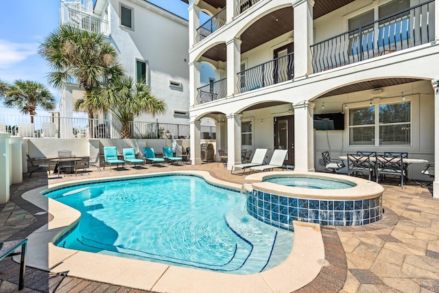18 Spyglass Dr, Miramar Beach, FL 32550 - view of swimming pool with a patio and a pool with connected hot tub