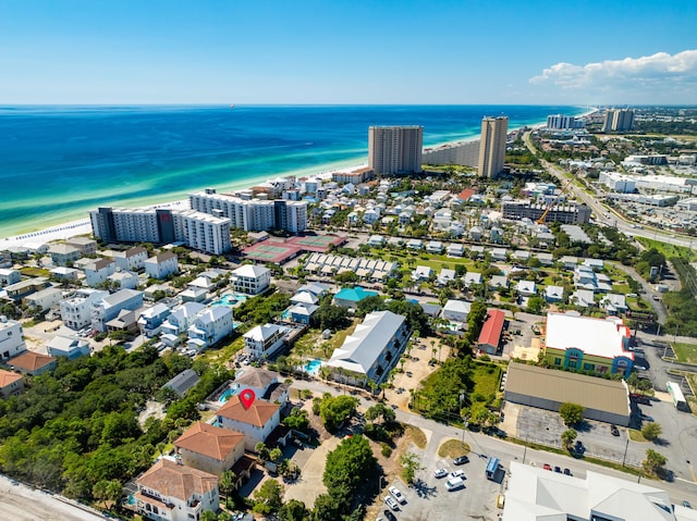 bird's eye view featuring a water view and a view of the beach