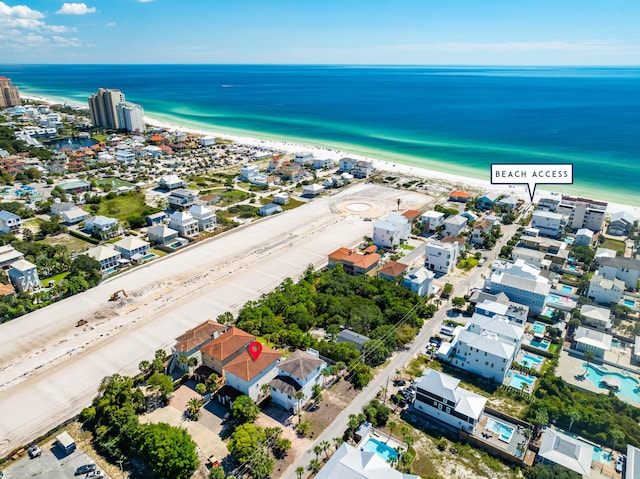 bird's eye view featuring a view of the beach and a water view