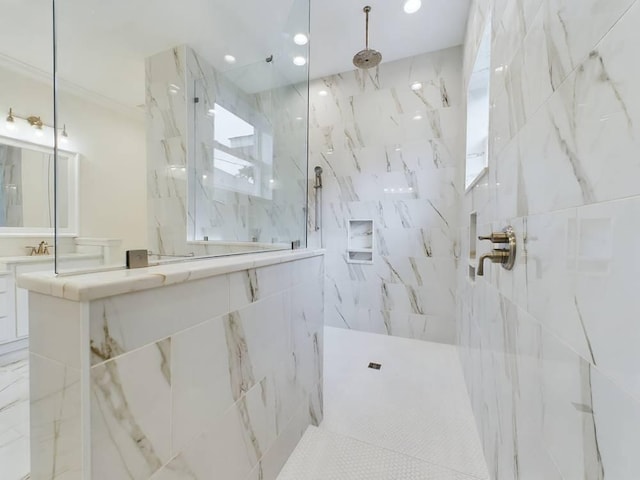 bathroom featuring crown molding and a tile shower