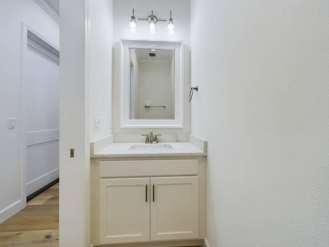 bathroom featuring vanity and hardwood / wood-style flooring