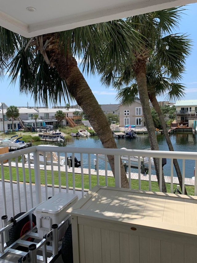 balcony featuring a water view