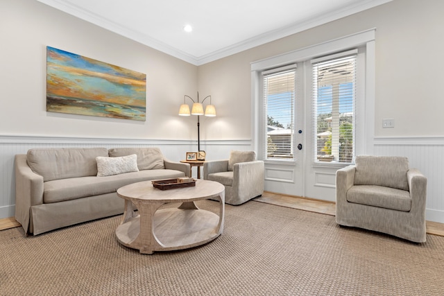 2448 Bungalo Ln, Miramar Beach, FL 32550 - living room featuring wainscoting, crown molding, and french doors