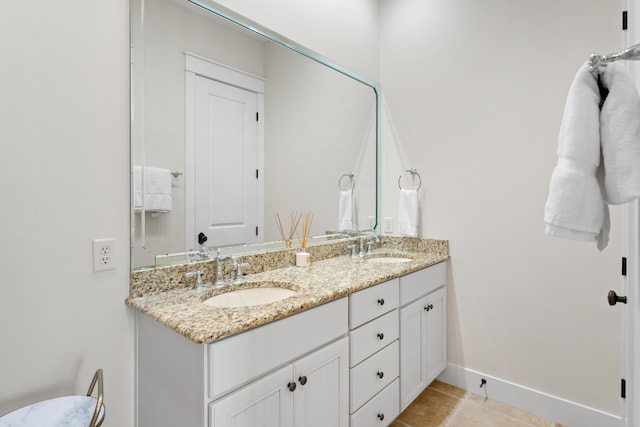 2448 Bungalo Ln, Miramar Beach, FL 32550 - bathroom featuring double vanity, tile patterned flooring, and baseboards