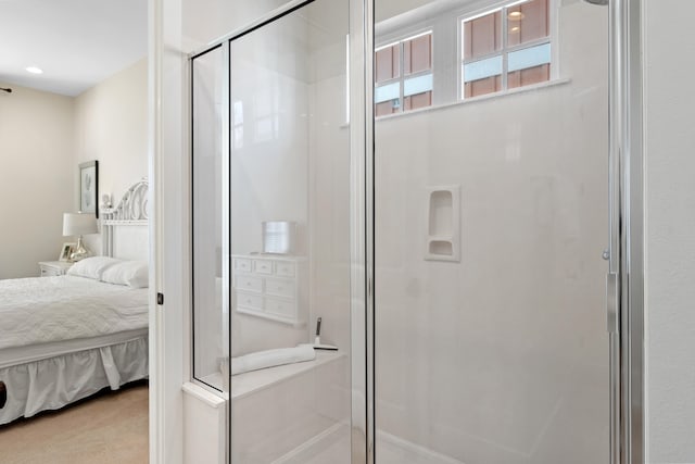 bathroom featuring a shower with door