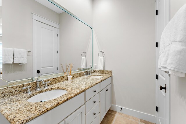 2448 Bungalo Ln, Miramar Beach, FL 32550 - full bath with double vanity, tile patterned floors, and baseboards