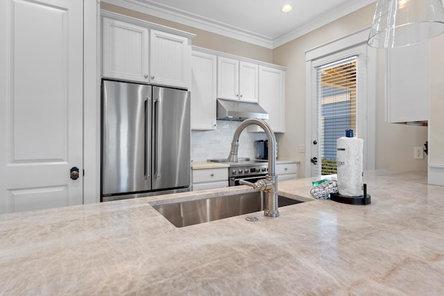 kitchen with ornamental molding, ventilation hood, stainless steel fridge, white cabinetry, and light stone counters