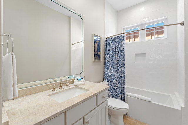 full bathroom with vanity, toilet, tile patterned floors, and shower / tub combo