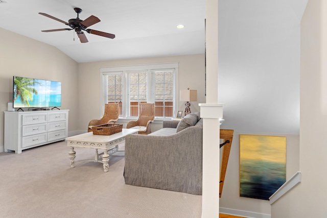 living room featuring ceiling fan, light carpet, and lofted ceiling