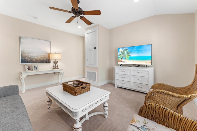 living room with lofted ceiling, light carpet, and ceiling fan