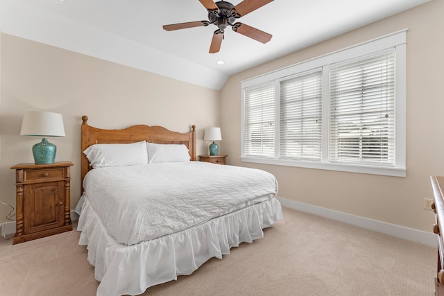 carpeted bedroom with lofted ceiling and ceiling fan