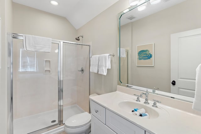 bathroom with vanity, lofted ceiling, toilet, and an enclosed shower